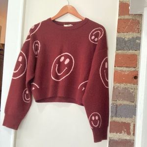 Altar’d state women’s smiley face sweater. Burgundy with pink